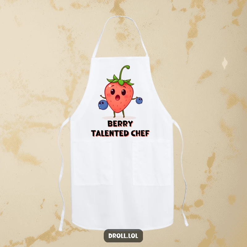 Funny apron depicting a surprised strawberry juggling small blueberries, bringing animated fun and humor to the kitchen.