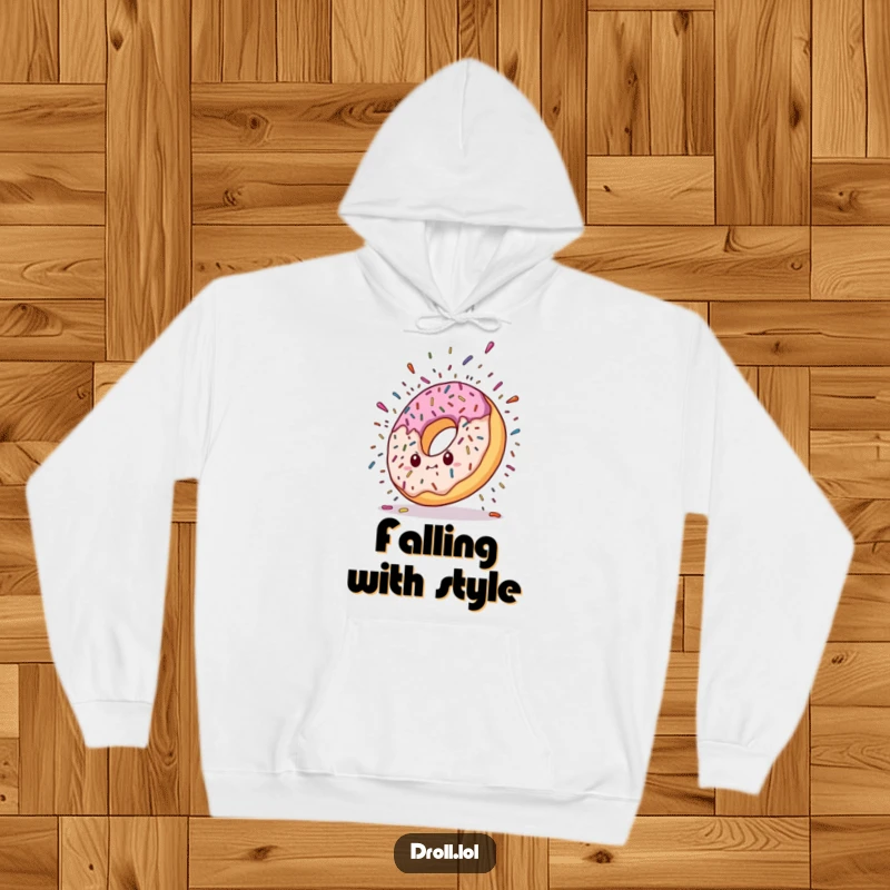 Funny hoodie depicting a donut character dramatically falling, with a vibrant explosion of colorful sprinkles creating a sweet, chaotic scene.