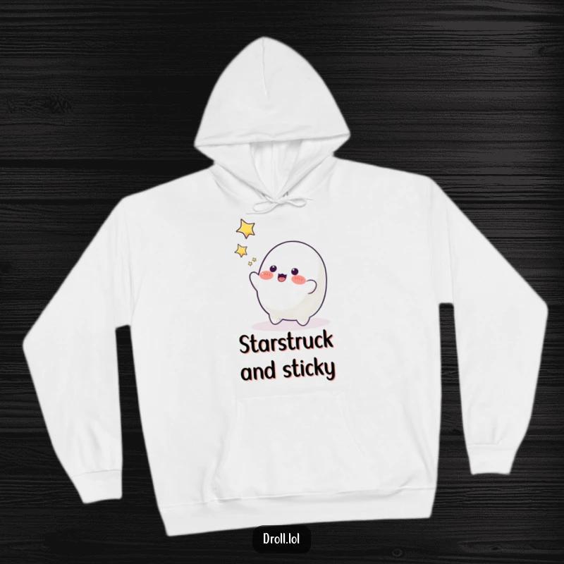 Funny playful blob character reaching for twinkling stars, a cozy and humorous hoodie for dreamers.