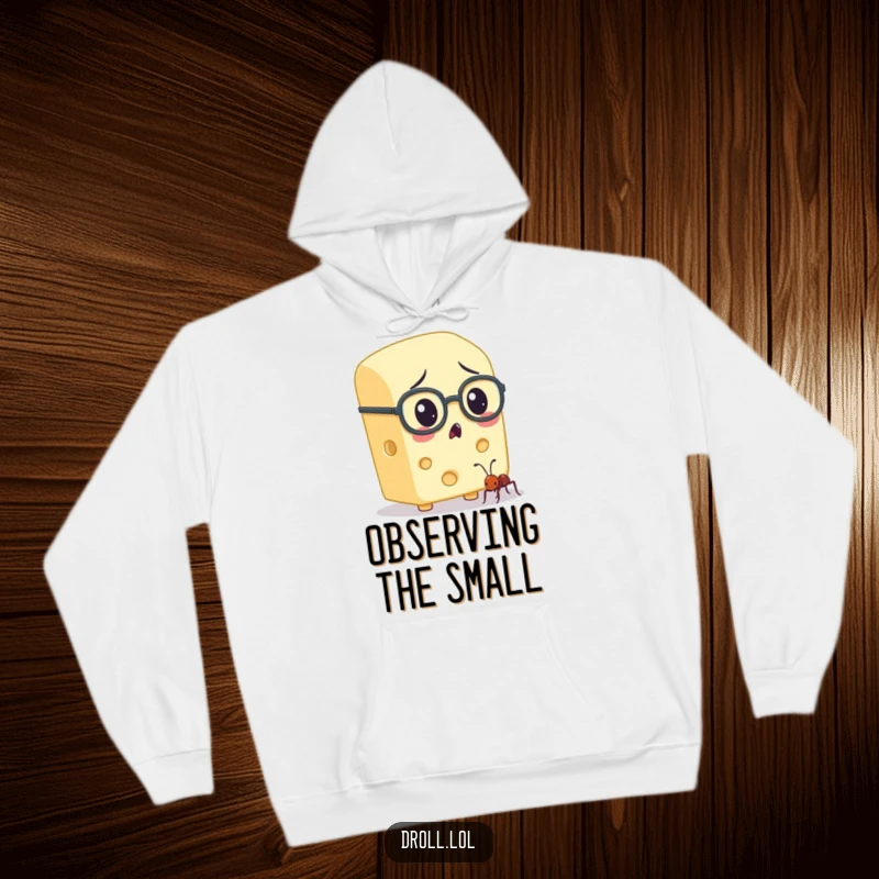 Funny cheese character with spectacles intently observing an ant, featured on a warm hoodie for intellectually humorous comfort.