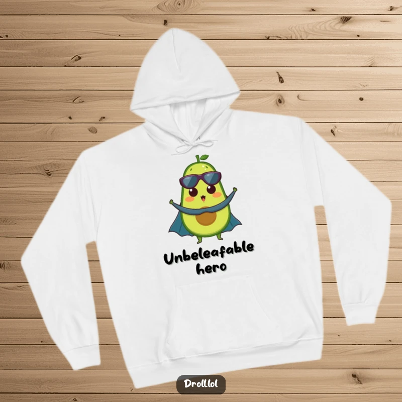 Funny hoodie: An avocado dons a superhero cape, looking surprised but ready for action, offering cozy, humorous protection.