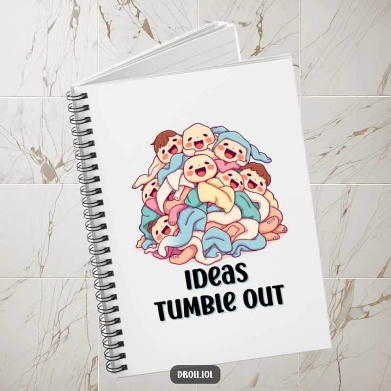 Funny laundry pile notebook with a happy pile of clean laundry tumbling on the cover.