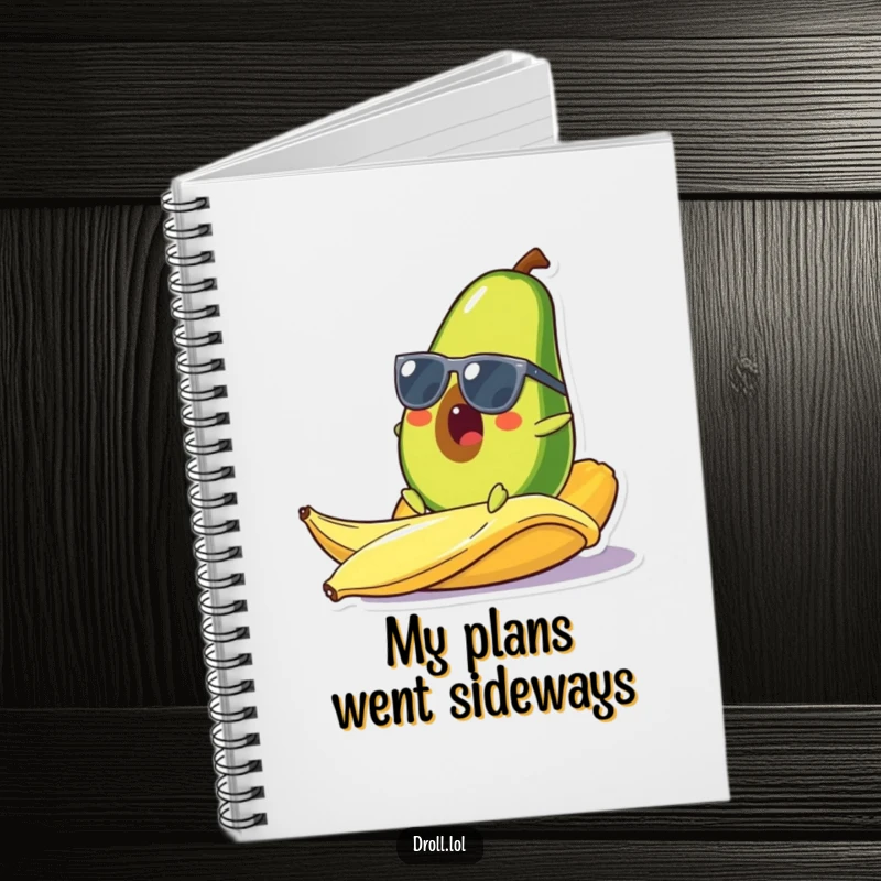 Funny notebook featuring a surprised avocado in sunglasses slipping on a banana peel, perfect for jotting down notes with a dose of comical flair.