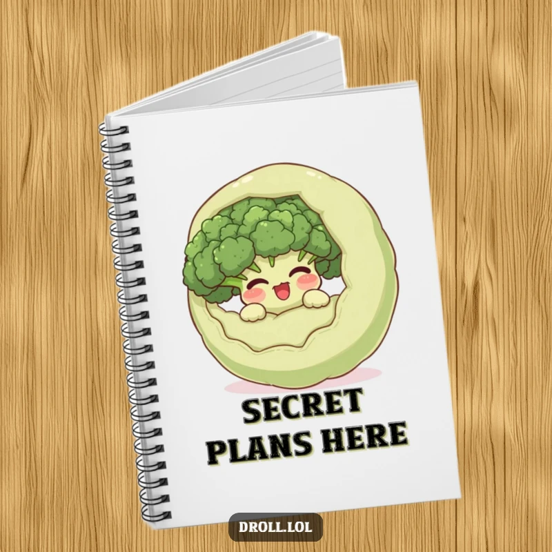 Funny giggling broccoli hiding inside a surprised vegetable on a notebook cover, a humorous stationery item for jotting down sneaky thoughts.