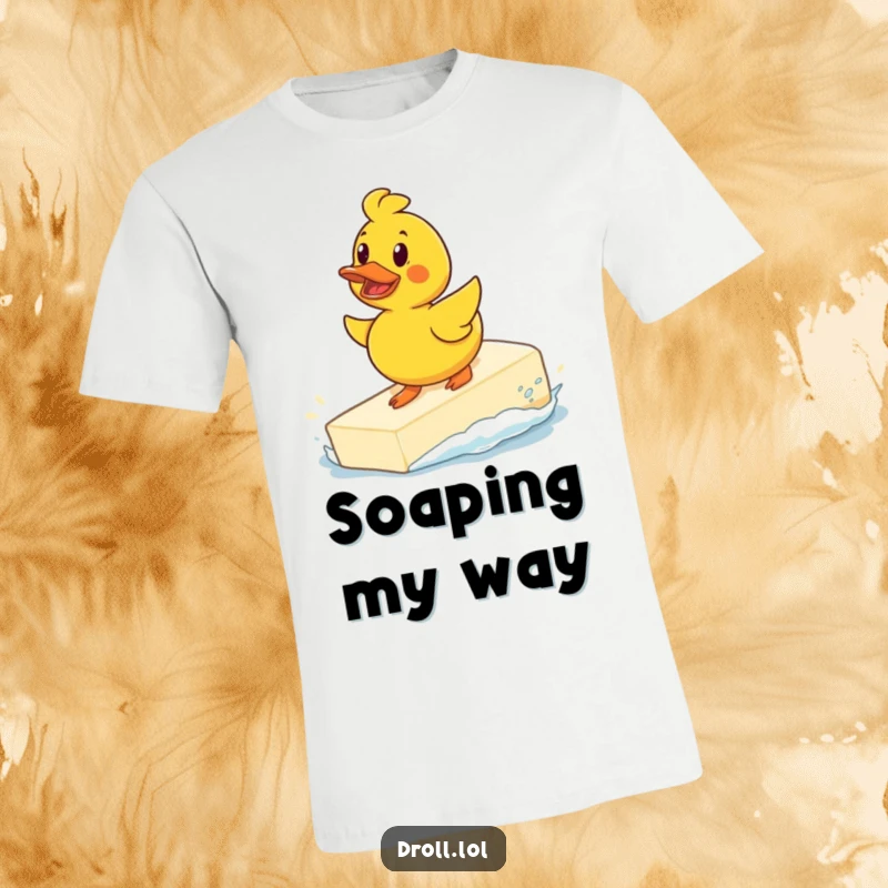 Funny determined rubber duck surfing a giant bar of soap on a t-shirt, depicting a humorous and daring water toy.
