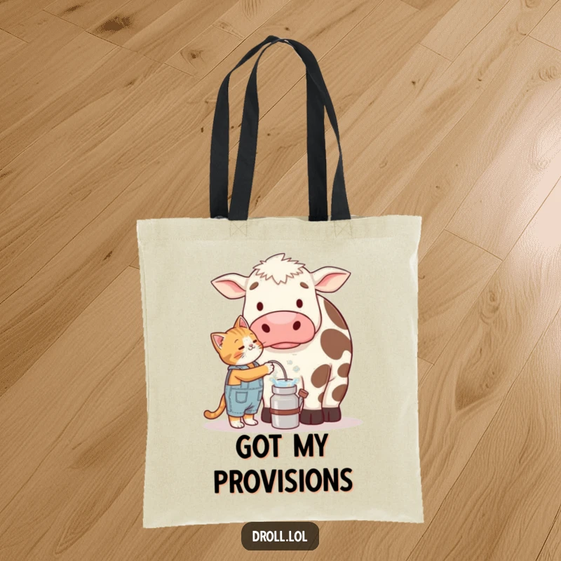 Funny tote bag illustrating a tiny cat in overalls trying to milk a massive, confused cow, capturing a humorous farm scene.